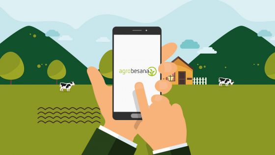 Ilustración de unas manos sujetando un móvil en el que sale la app de Agrobesana